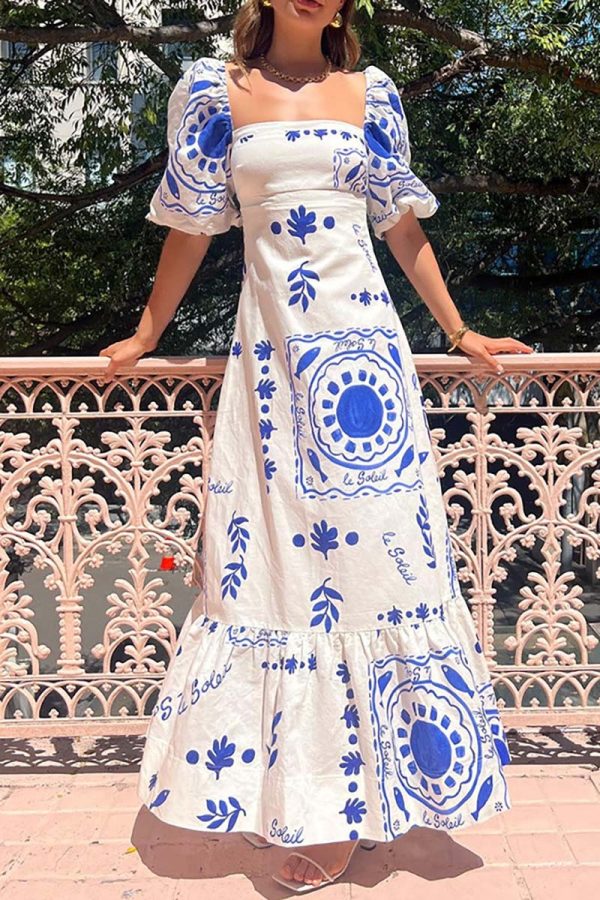 Vestido largo estampado de manga corta abullonada en azul. - Imagen 3